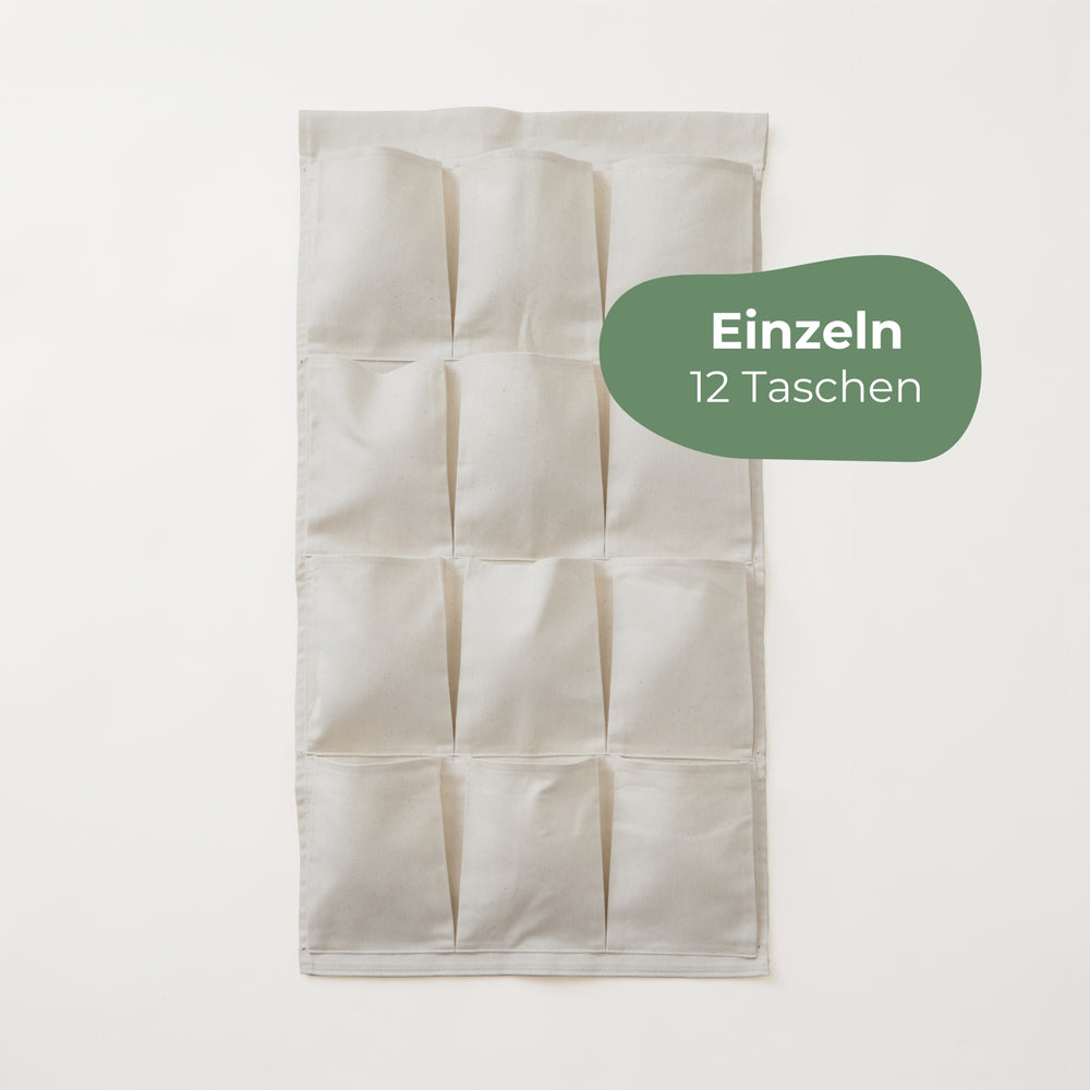 Kura Aufbewahrung aus Baumwollstoff mit 12 Taschen.