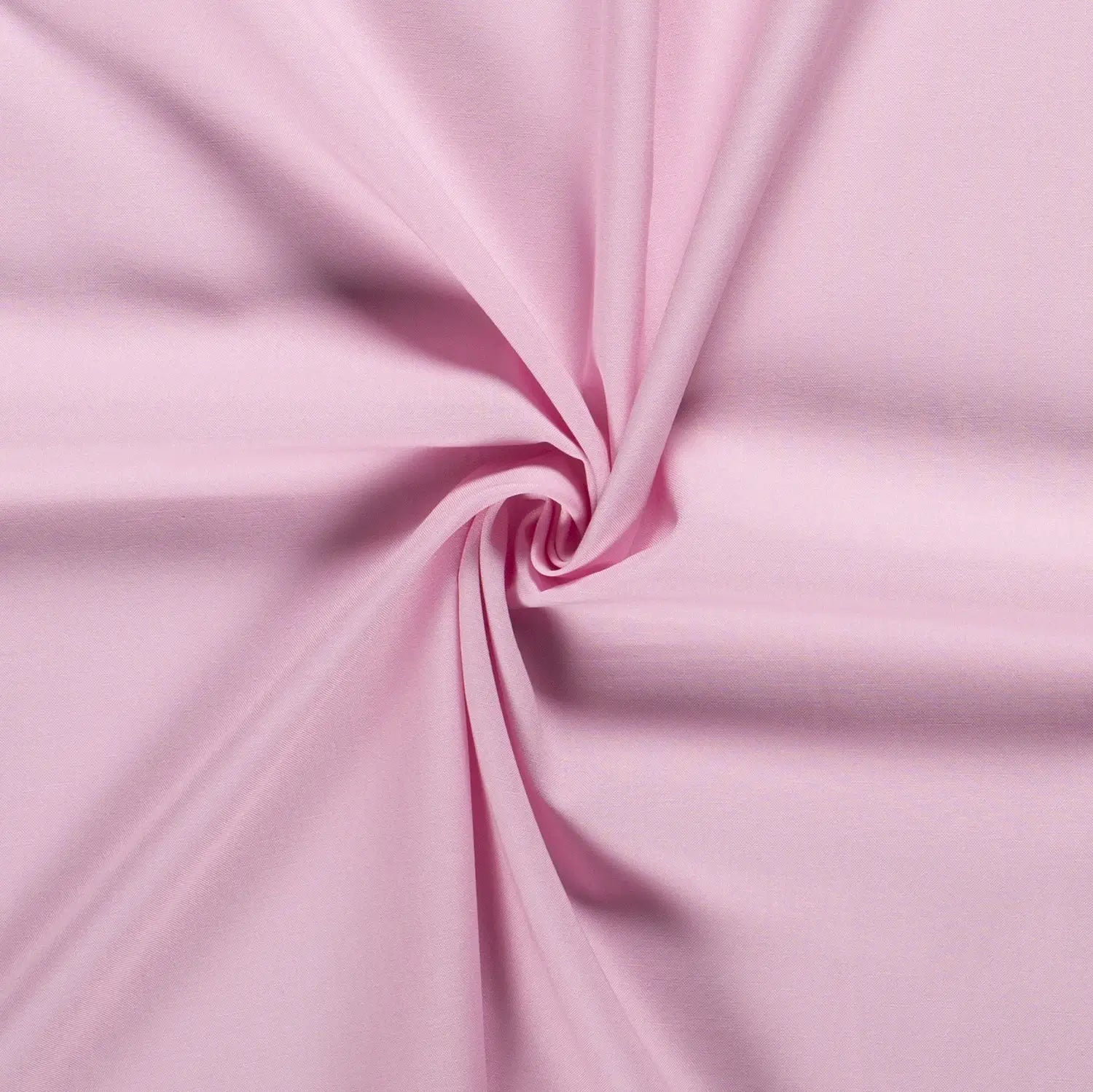 Detailansicht eines pink farbenden Vorhangstoffs in dem in der Mitte eine gefaltete Spirale zu sehen ist